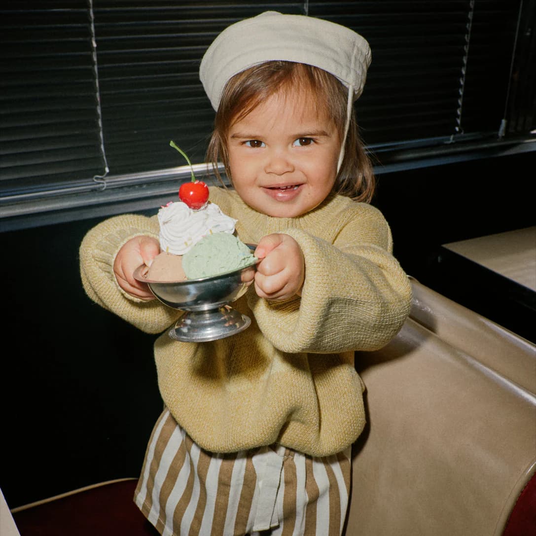 Child holding a dessert